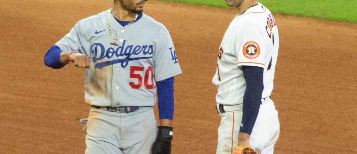 Los Angeles Dodgers Mookie Betts talks with Carlos Correa in the 7th inning after tempers flared up.