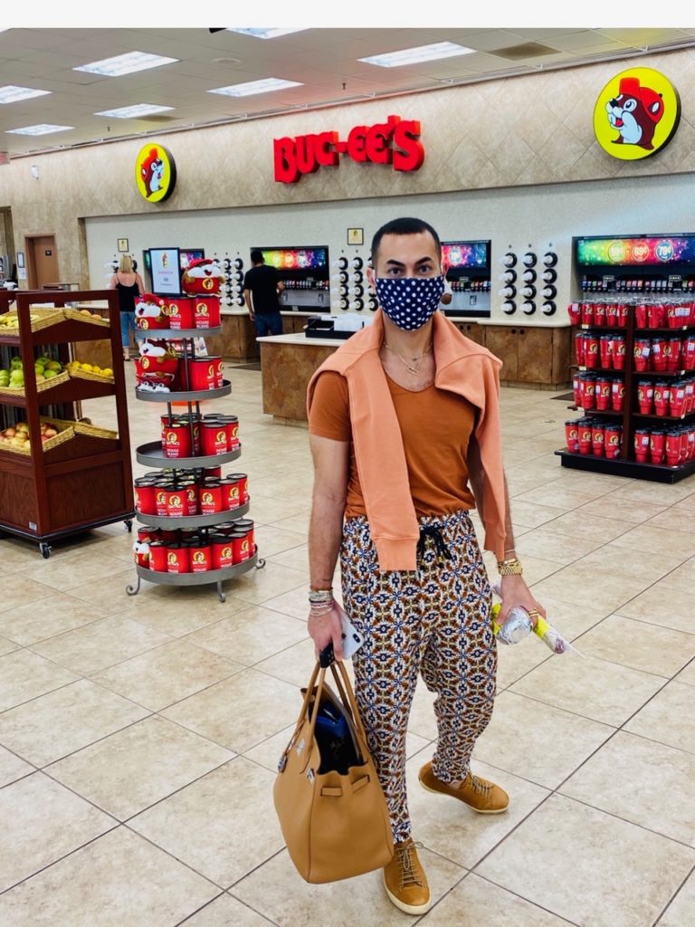 Fady Armanious dons a mask by his partner Bill Baldwin's sister, Mickie Baldwin Ross, for a road trip. (Courtesy photo)