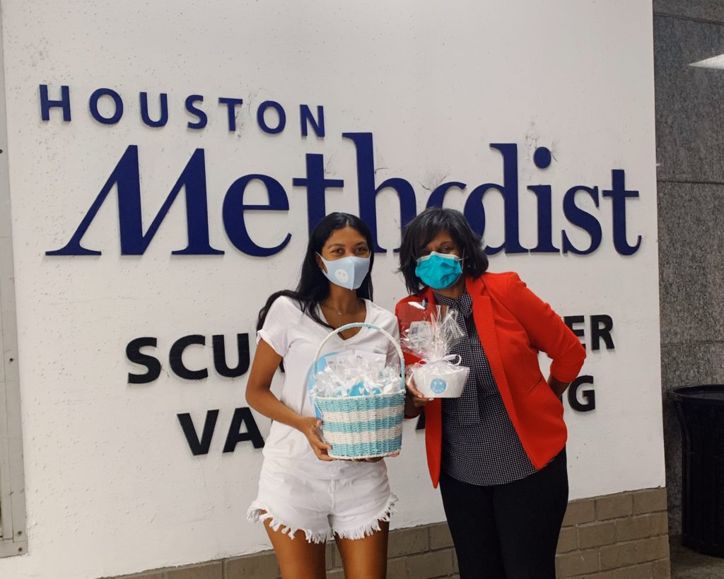 Gia McCrae at Houston Methodist giving Stephanie Houston hand-crafted care package
