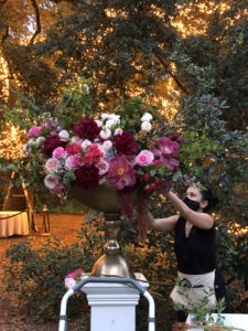 Sage ‘n’ Bloom’s designer Wendy Du puts finishing touches on an arrangement for a wedding at The Houstonian. (Courtesy photo)