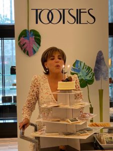 Hallie Vanderhider blows out the candles on the petite cake for her petite birthday party at Tootsies.