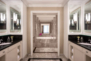 Your well-appointed bathroom equipped with a tub perfect for diving into your copy of “The Chiffon Trenches: A Memoir.”