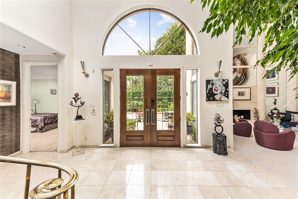 From the entry, one steps into a vast entertaining/living area in a open plan design. Note the downstairs master to the left.
