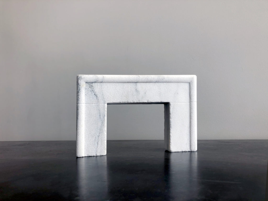 Sea Ranch fireplace in Vermont Danby marble with a French Quarter finish