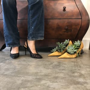 Satin heels, “Daphne’s Shoes,” filled with green growing things, await their journey. And in the meantime? Perfect visitor iPhone photo-op at Heidi Vaughan Fine Art. (Photo by Mary Margaret Hansen)