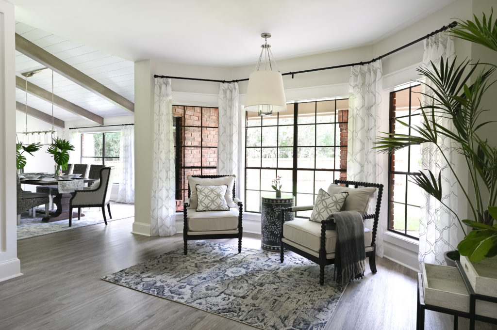 A comfortable sitting area created by Charbonneau Interiors as staged decor for a home in The Woodlands.