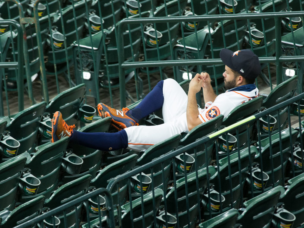 Jose Altuve lounged in the stands in a rare off night. (Photo by F. Carter Smith) 