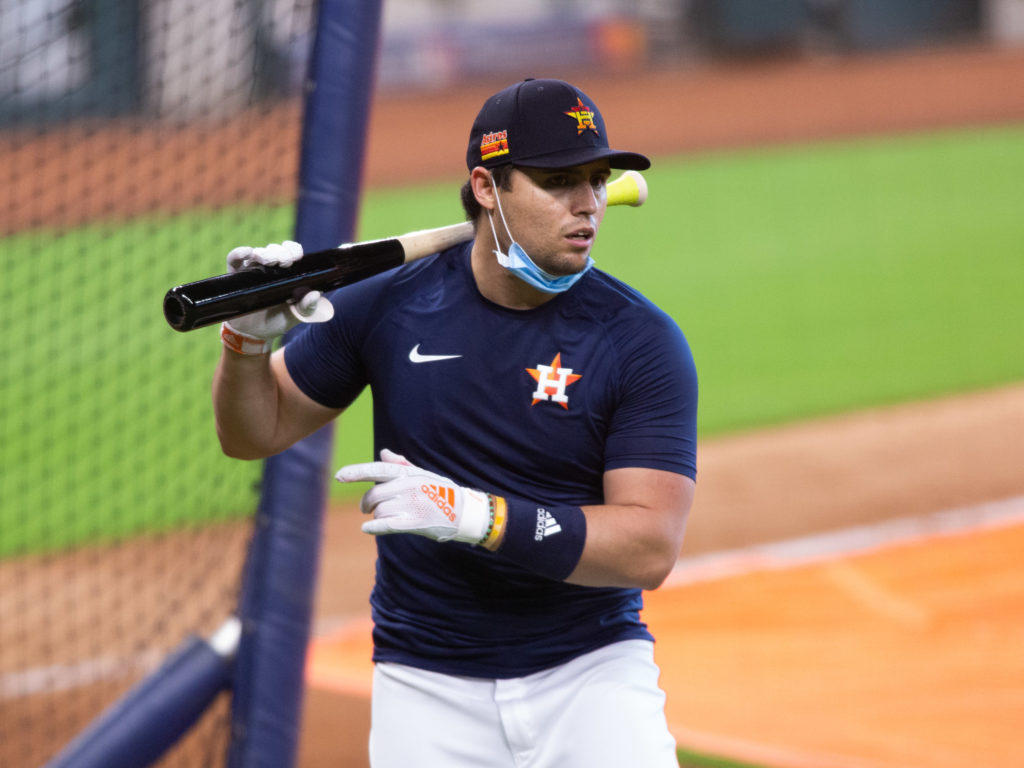 Cuban infielder Aledmys Diaz begins his second season for the Astros and plans to wear a mask on the field to protect his wife and kids.