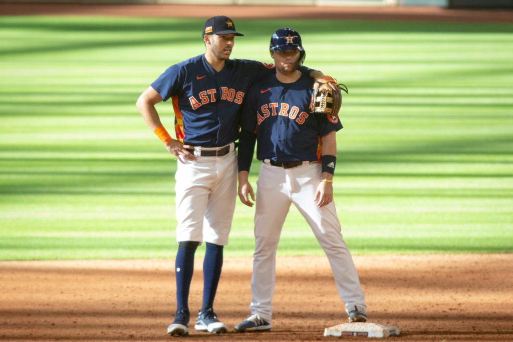 Carlos Correa puts his arm around Aledmys Diaz. (Photo by F. Carter Smith.)
