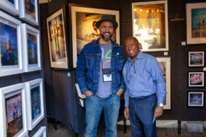 Mayor Sylvester Turner joins a Bayou City Art Festival contributor from previous years. (Photo by Katya Horner)