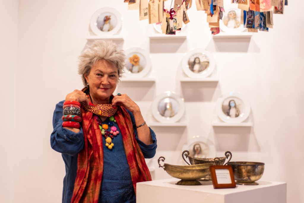 Mary Margaret Hansen contemplates her latest exhibition, "Atablo' " at Heidi Vaughan Fine Art through August 29, 2020. (Photo by Krzysztof Kwiatkowski)