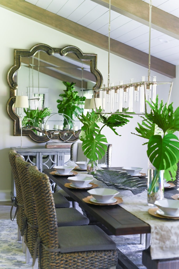 The oversized quatrefoil statement mirror commands attention in the formal dining room. 