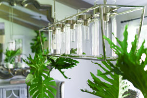 The contemporary chandelier in the dining room is from Visual Comfort.