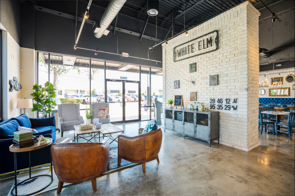 The front entrance of White Elm Café Bakery presents a comfy living room setting for guests who will eventually be able to wait indoors for tables. (Photo by Shannon O'Hara)