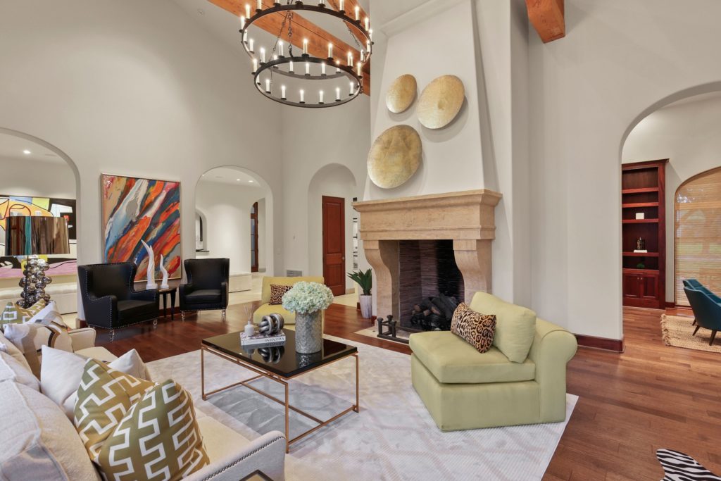 Vaulted ceilings rise in the living room.