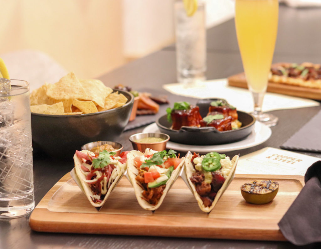 The taco flight is a great way to try an achiote chicken, brisket, and boar tacos.
