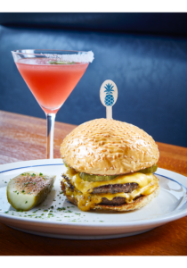 The Cheeseburger paired with a martini, perhaps the best way to end your afternoon. (Photo by Courtesy of Vandelay Hospitality Group)