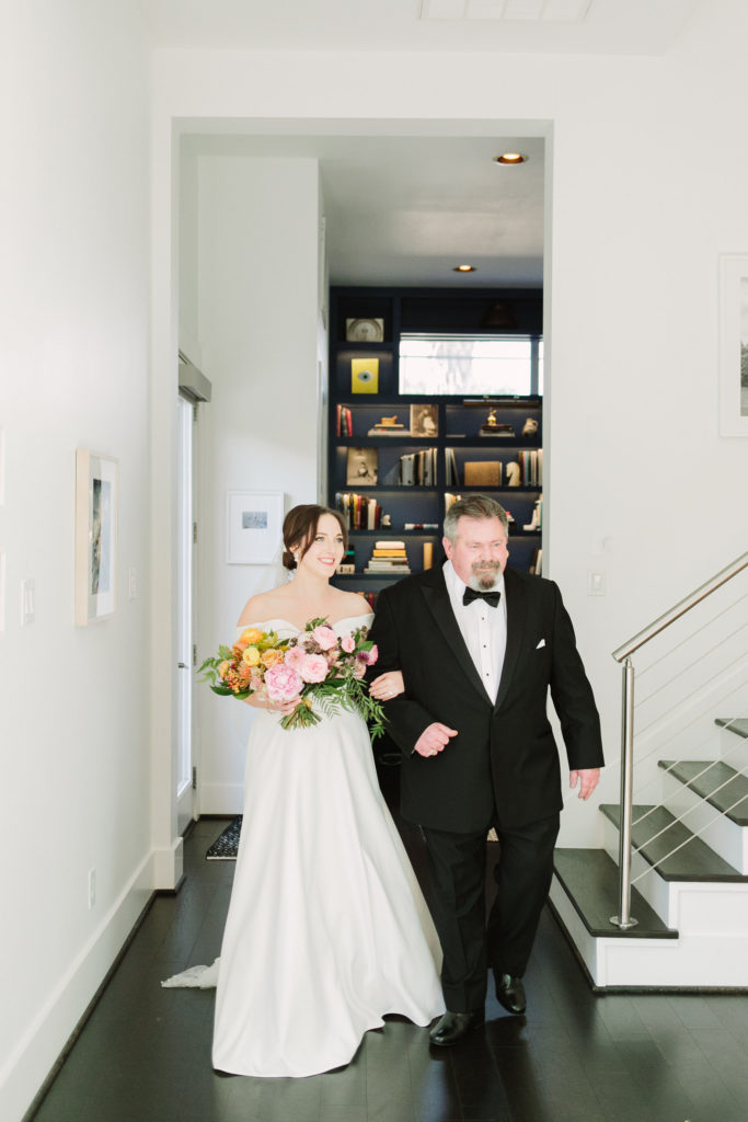 The bride's dad, David Davis, walks her down the aisle. (Photo by Mustard Seed Photography)