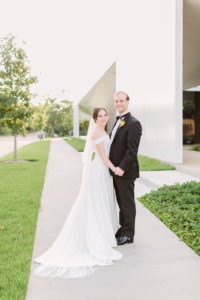 Ashlyn Davis Burns and Luke Burns pose for their wedding portrait at The Menil Drawing Institute. (Photo by Mustard Seed Photography)