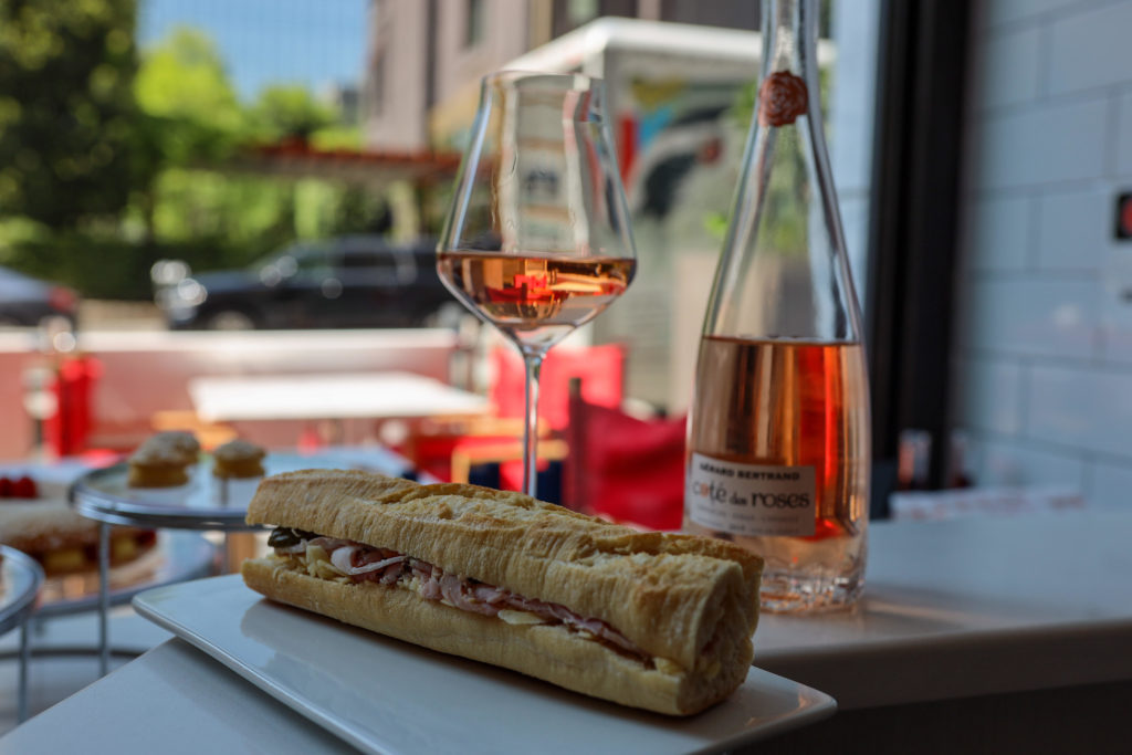 A glass of wine pairs well with the jambon beurre.