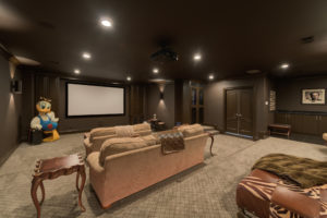 This home theater is more living room than movie theater, a comfy corner for watching Schitt’s Creek.