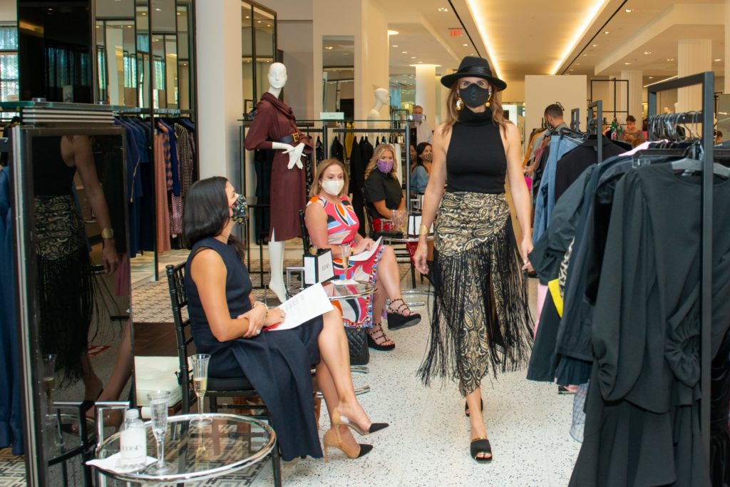Jonathan Simkhai skirt outfit topped off with a Eugenia Kim hat. (Photo by Jacob Power)