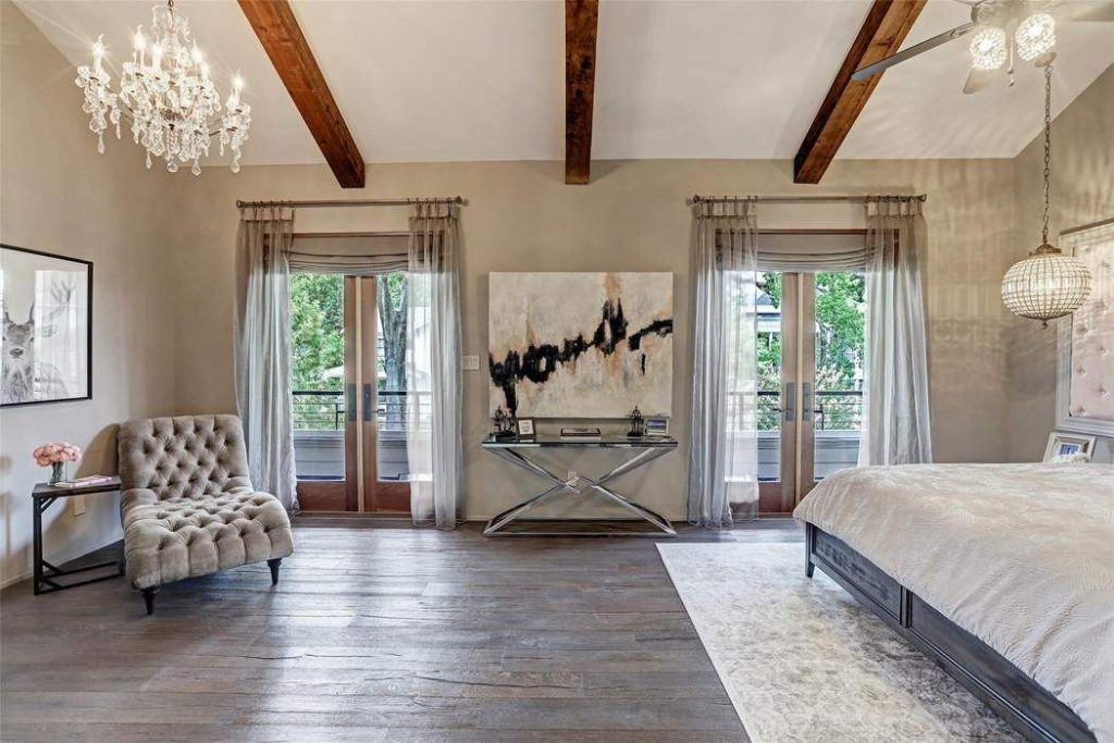 The second-floor master suite opens through French doors to a balcony that runs 37.5 feet in length.