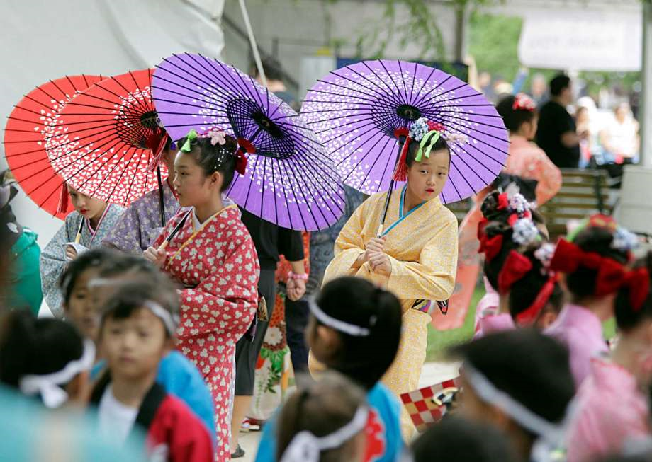 Ashley Chu, Teaching to Give's fundraising director, dances in the Japan Festival.
