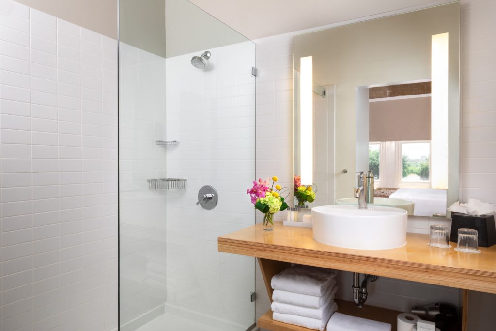 Bathrooms in guest rooms have very modern and clean vibes. (Courtesy of CANVAS)