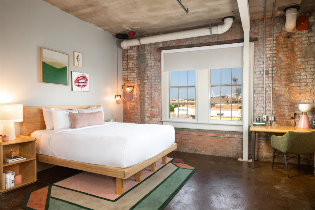 Guests rooms have been remodeled with exposed brick, concrete floors, and more raw materials. (Courtesy of CANVAS)