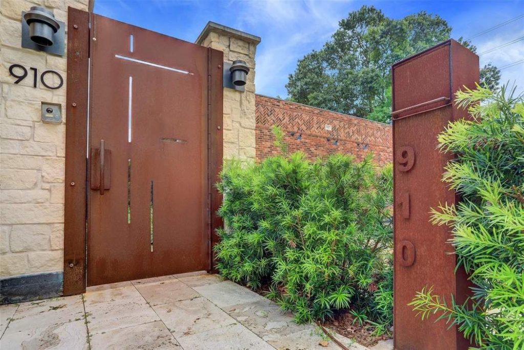 A blacksmith was contracted to create the iron door, fence, and standing mailbox.