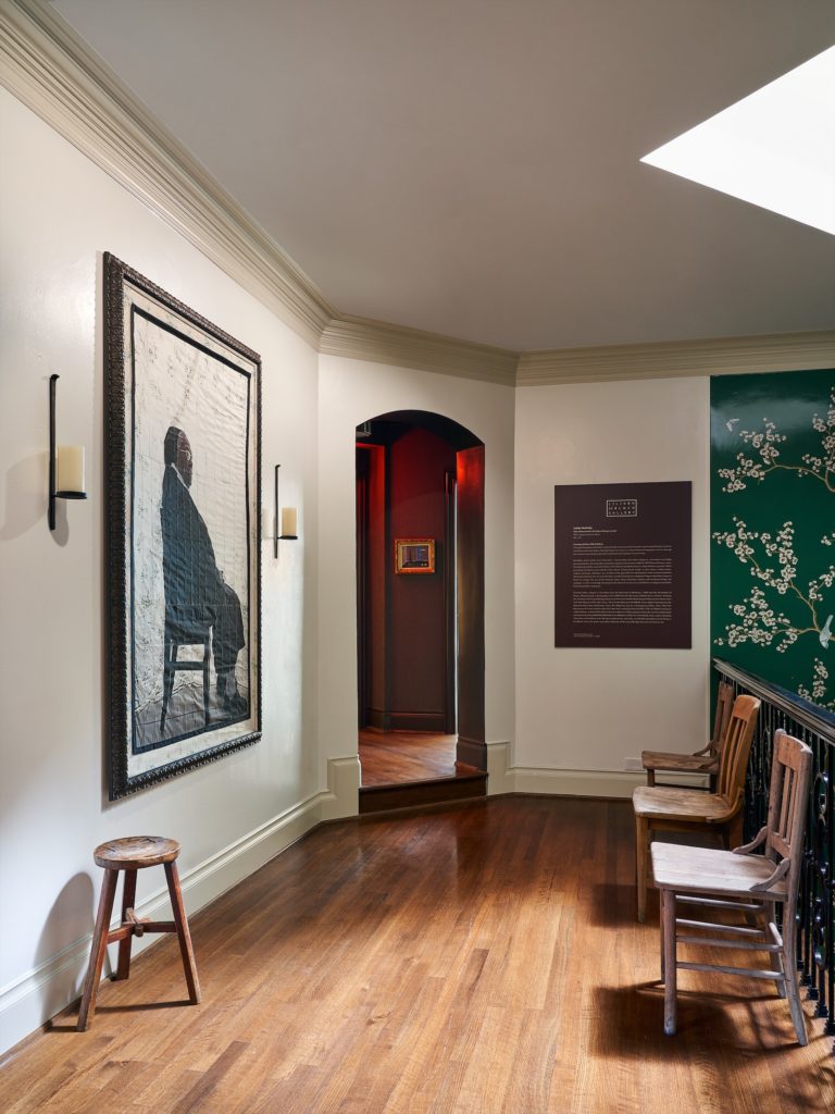 Upstairs landing with artist Letitia Huckaby's "Sister Rebecca," represented by Liliana Bloch Gallery.  (Photo by Stephen Karlisch)