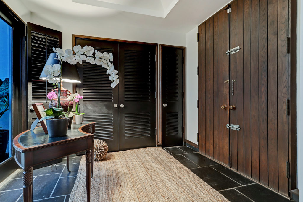 Massive wooden doors offer entry to the 3,224 square foot townhouse.  (Photo by TK Images)