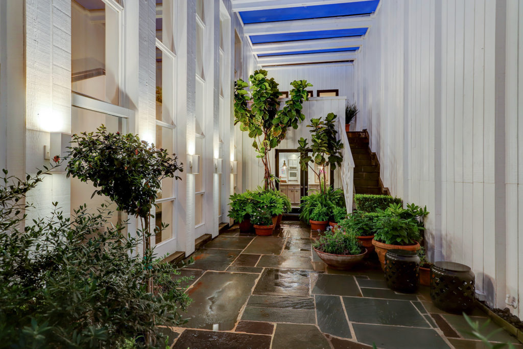 Two interior courtyards provide unique daylight and space for greenery in the townhouse design. (Photo by TK Images)