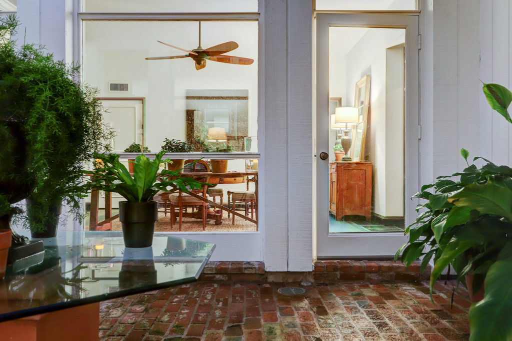 The interior courtyards are paved with antique bricks, lending a note of warmth to the space. (Photo by TK Images)