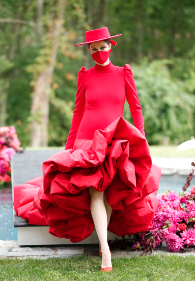 Model Coco Rocha closed the Christian Siriano runway show in red ruffled gown and then jumped into the pool. (Photo courtesy of Christian Siriano)