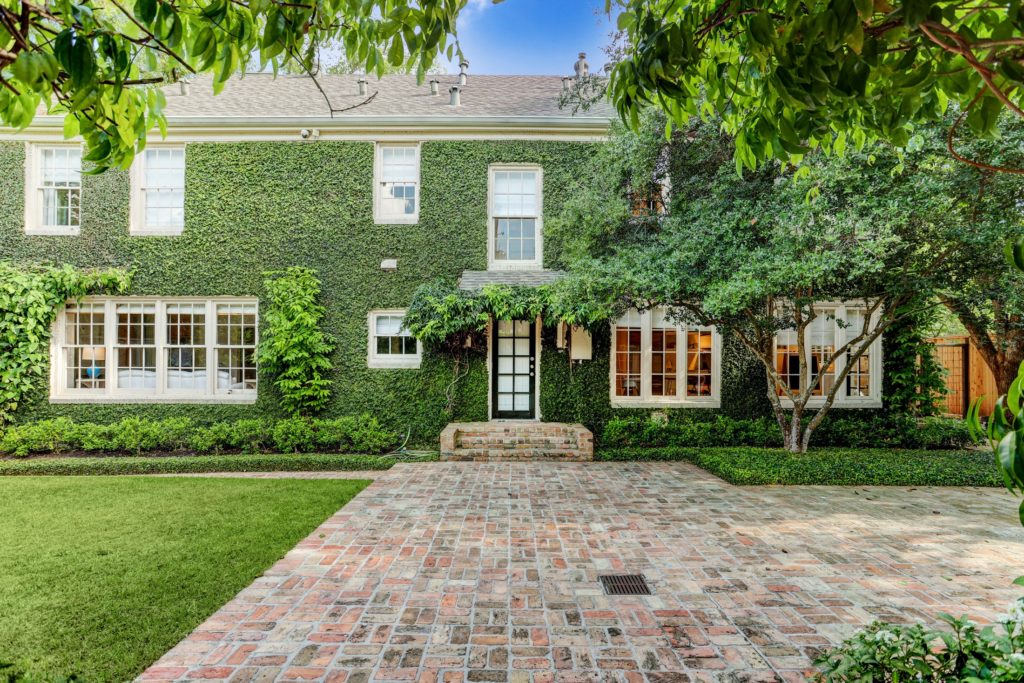 The back facade is blanketed in verdant ivy.  (Photo by TK Images)