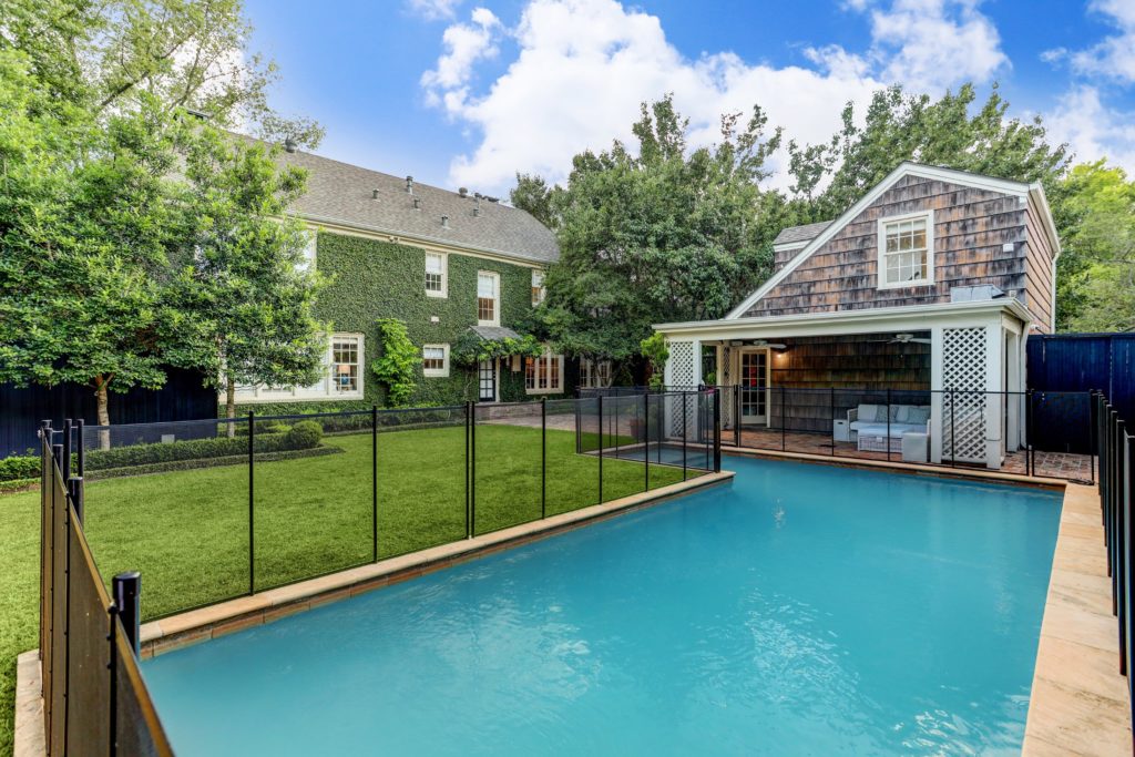 The covered seating area overlooks the swimming pool which is fenced to protect youngsters. (Photo by TK Images)
