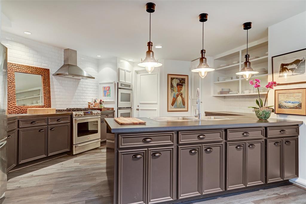 The kitchen at 5000 Longmont has been updated from its original mid-century design. (Photo by TK Images)