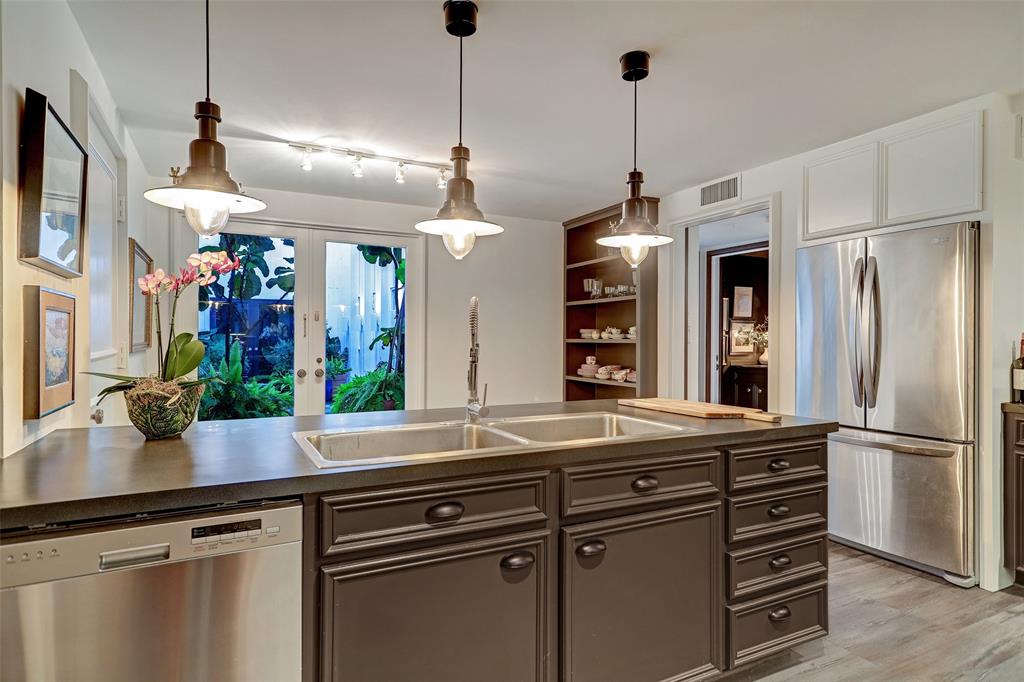 The kitchen at 5000 Longmont has been updated from its original mid-century design. (Photo by TK Images)