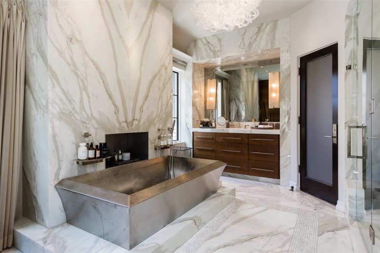 A marble covered bathroom suite. (Photo by Alex Perry, Allie Beth Allman & Assoc.)