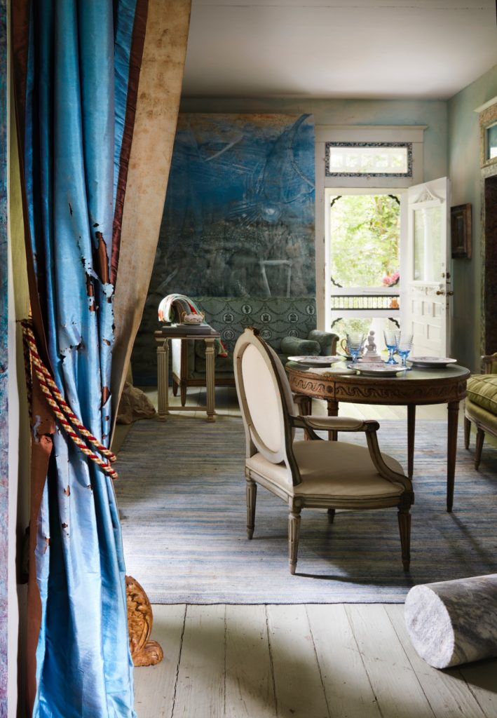 A doorway is curtained by tattered antique saris. (Photo by Lisa Petrole, Art Direction by Michelle Aviña)