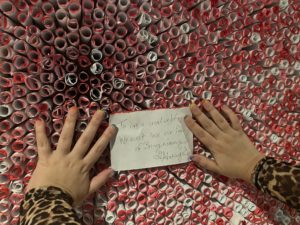In Illegal Art’s “The Last Word,” visitors are encouraged to unwrap and read the messages, some of which are extremely moving. (Photo by Anna Votow )