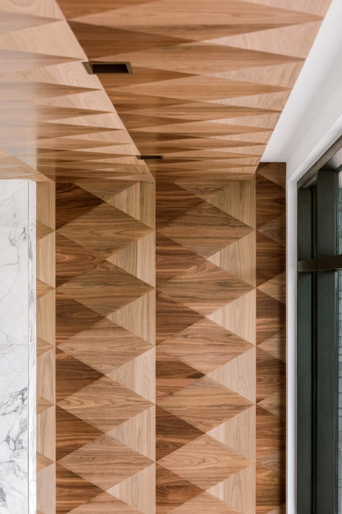 A wood floor on the ceiling is just part of how Giorgetti Houston breaks from the mold. (Photo by Divya Pande)