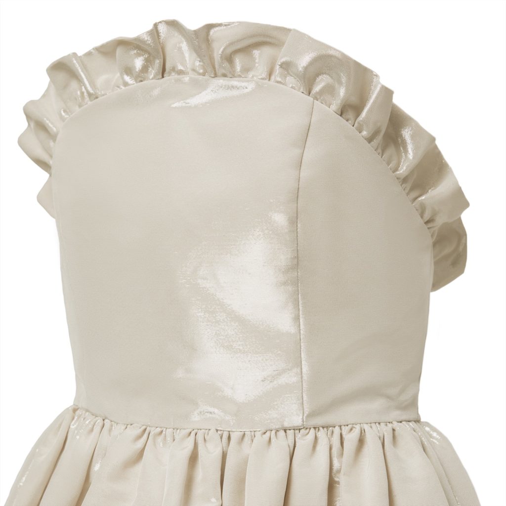 Details on a couture gown that reflects Shaikh's own style: "classic and clean with feminine touches of bows and ruffles." 