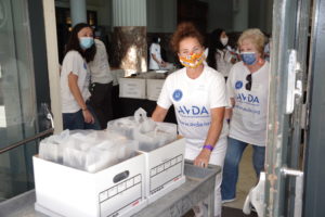 Astros volunteers delivering dinners from Potente for the AVDA 40th anniversary fundraiser. (Photo by Keith Kilson)