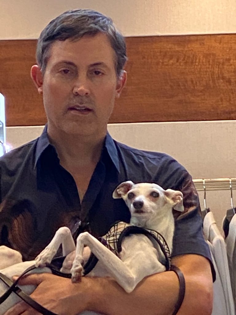 Jewelry designer Nak Armstrong brought his Italian greyhound, Georgie, along for the fashion presentation at Elizabeth Anthony. (Photo by Shelby Hodge)