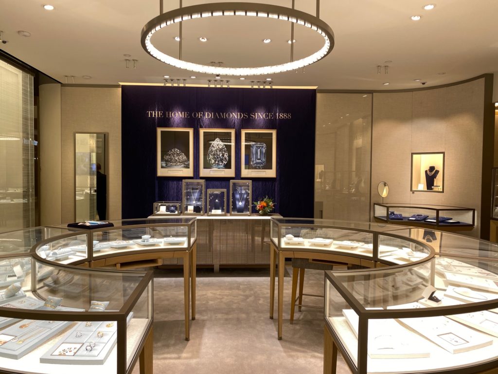 A rock crystal chandelier and an LED light-filled ceiling spotlight the dazzling diamond collections.