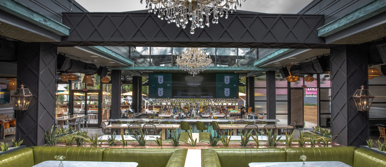 With the retractible roof open at The Sporting Club on Washington Avenue opens day and night for a grand al fresco dining experience.
