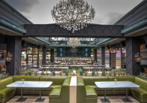 With the retractible roof open at The Sporting Club on Washington Avenue opens day and night for a grand al fresco dining experience.